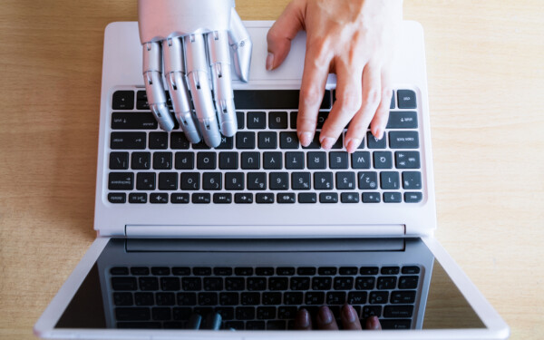 Robot hands and fingers point to laptop button advisor chatbot robotic artificial intelligence concept