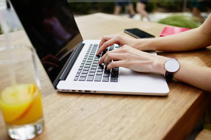 Woman typing on laptop